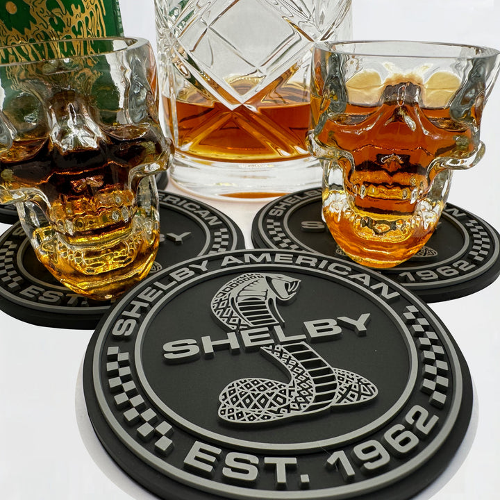 Close up of Shelby American coasters being used with different cocktail glasses