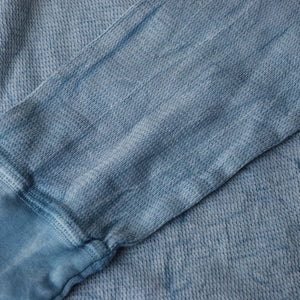 Pale blue thermal long sleeve shirt close up of left sleeve and cuff