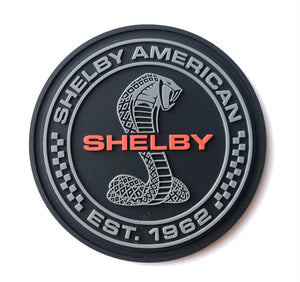 Black, red and gray rubber patch featuring Shelby American and '62 AC Cobra 