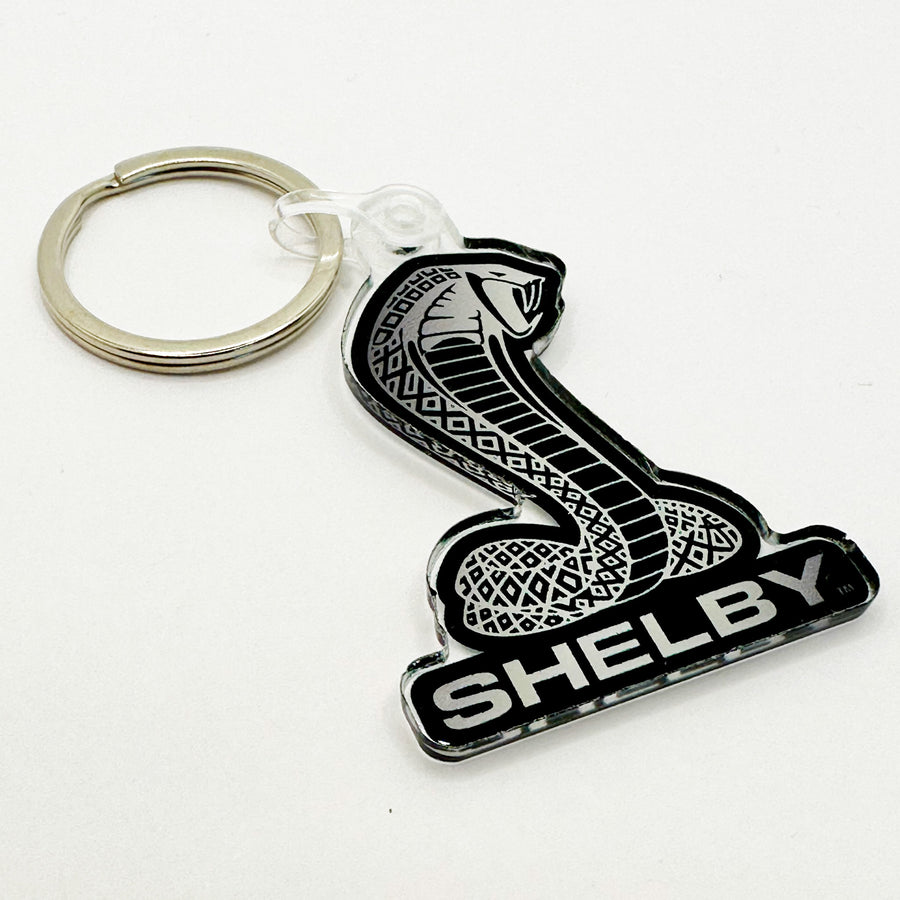 Front view of Shelby cobra keychain in black and white