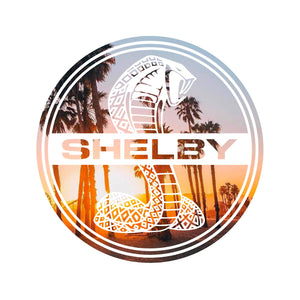 Magnet showing the Shelby Cobra logo in white against a subtropical setting in Las Vegas