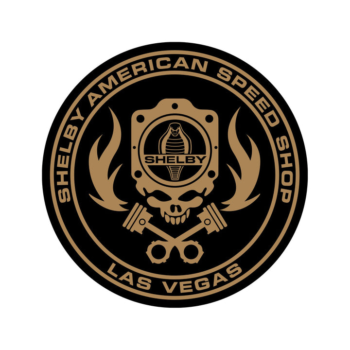 Black and gold Shelby American Speed Shop sticker with a skull, gasket, flames and a Shelby Cobra