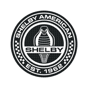 Black and white magnet with carbon fiber pattern, showing Shelby American Est. 1962 and a Cobra