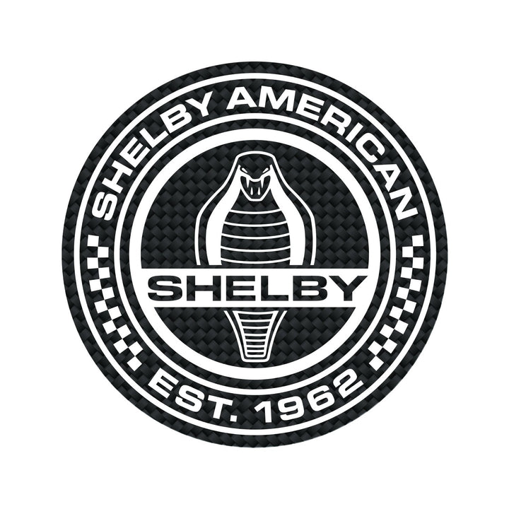 Black and white magnet with carbon fiber pattern, showing Shelby American Est. 1962 and a Cobra