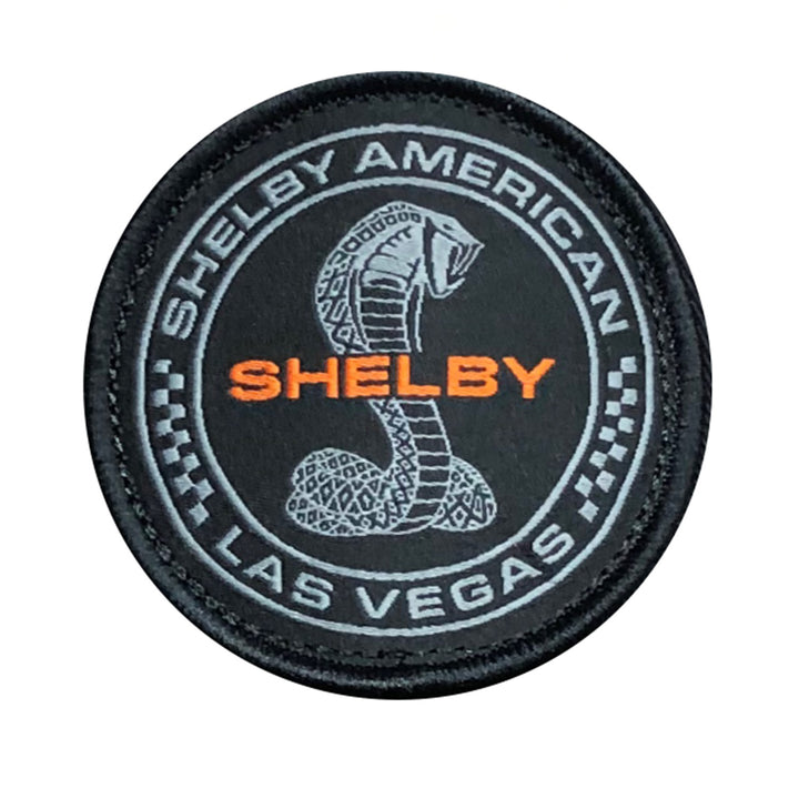 Black and orange woven patch showing Shelby American Las Vegas and a Cobra logo