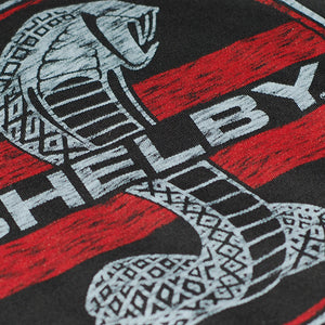 Close up of Red Shelby Cobra logo on a long sleeve graphic shirt in gray