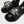 Load image into Gallery viewer, Close up of two feet wearing Shelby sandals and skull-and-wrench graphic socks
